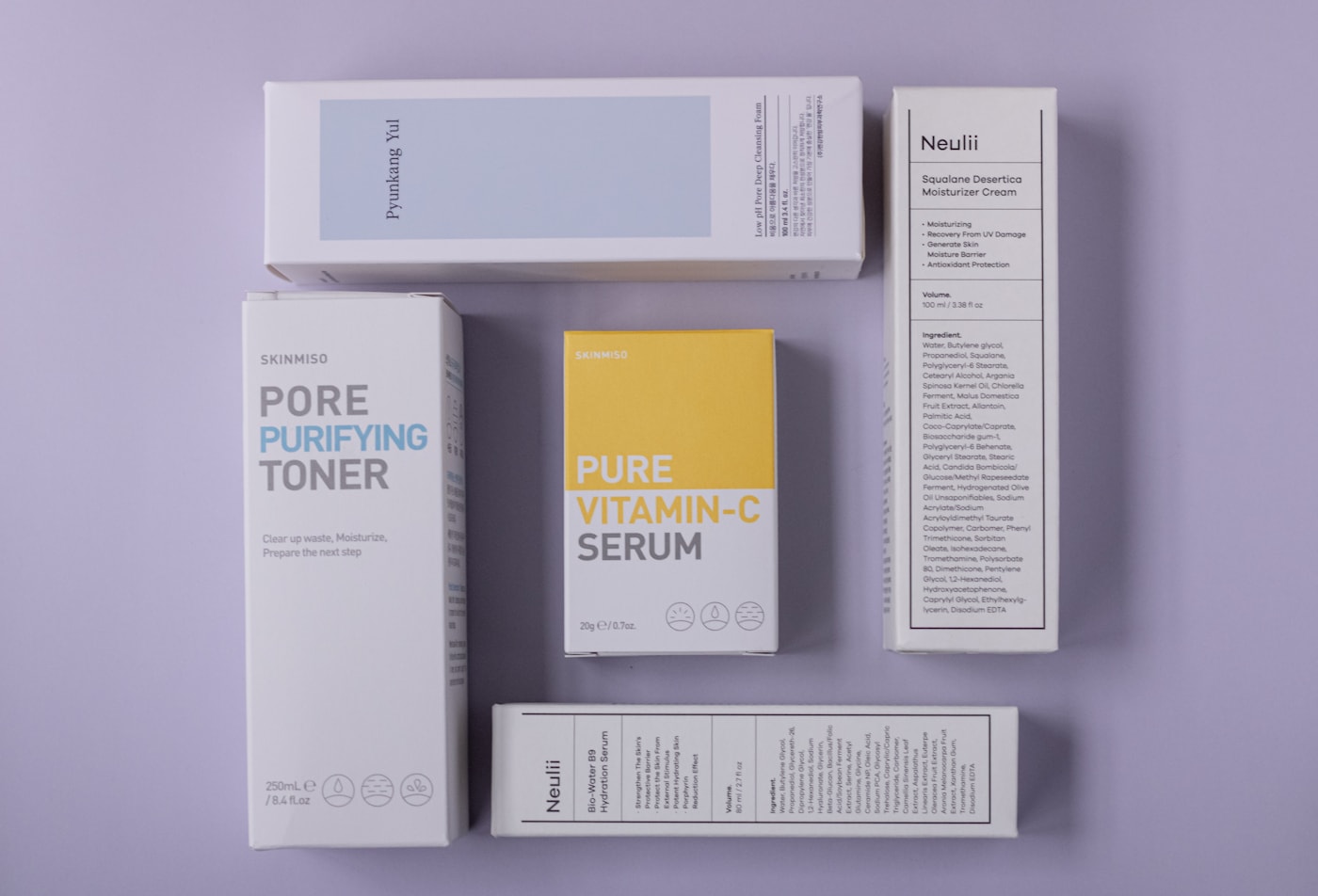 Skincare product and packaging styled on a desk